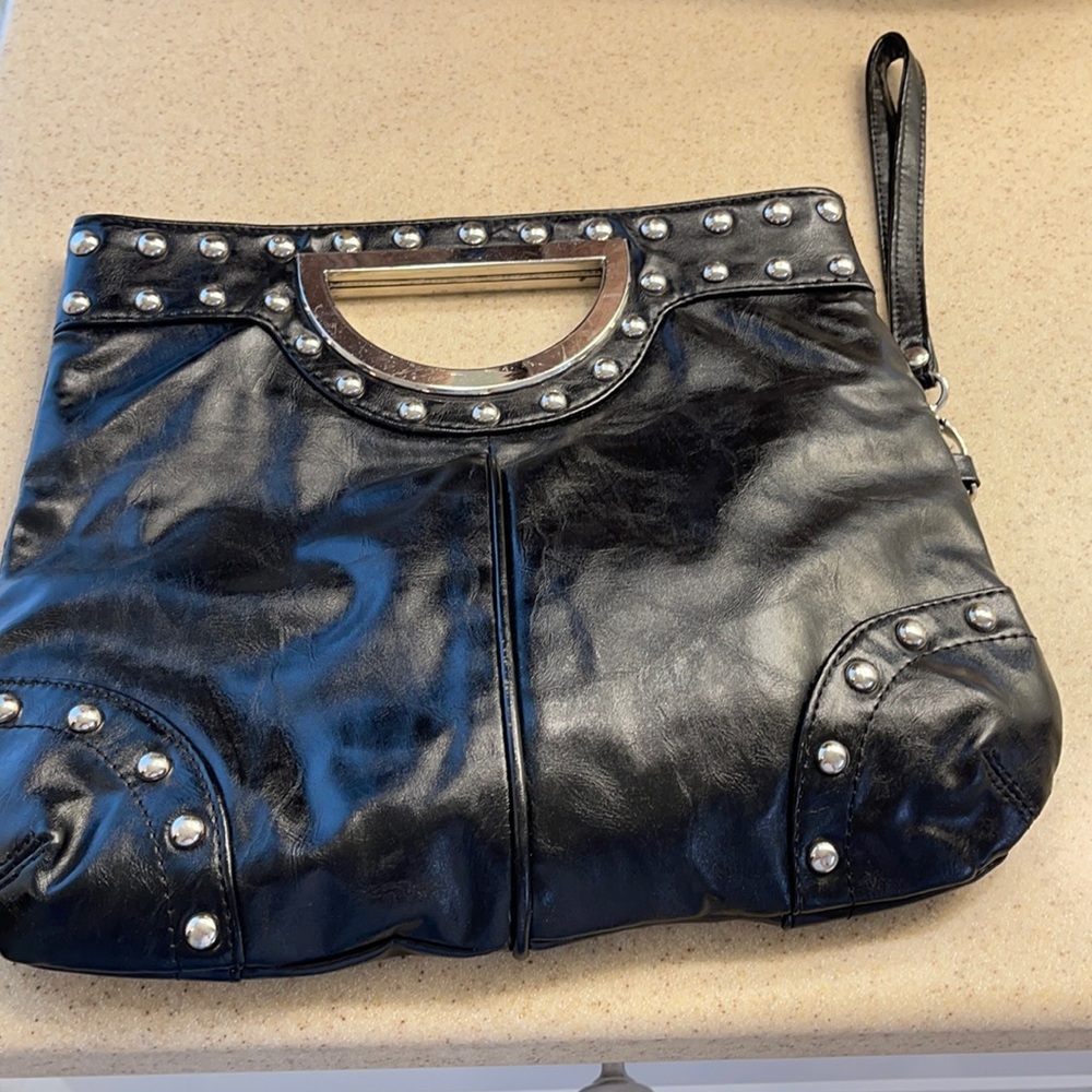 A black leather clutch bag